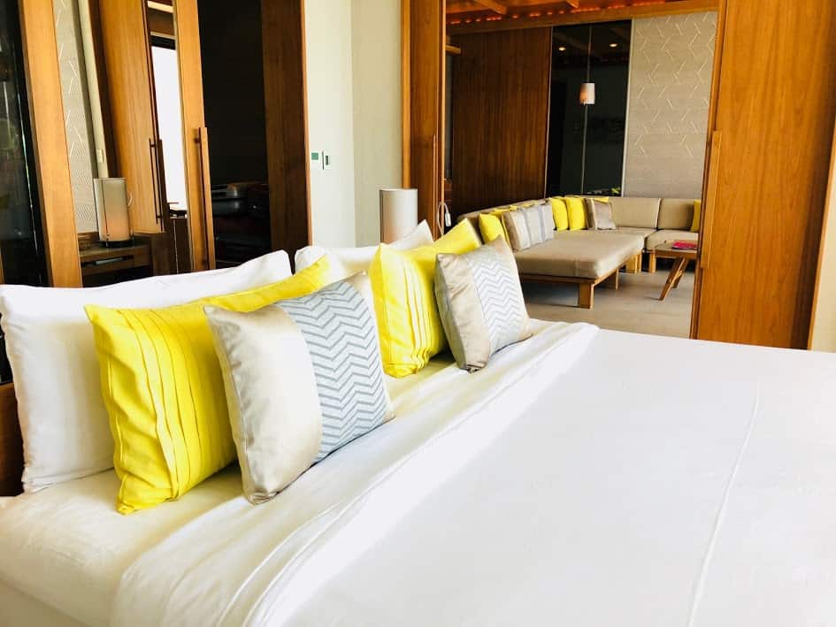 luxury hotel bed yellow pillow